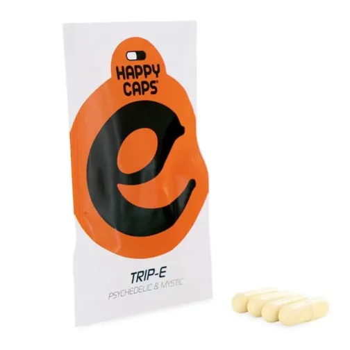Sachet blanc et orange de Happy Caps Trip-E avec quatre gélules beiges posées à côté.